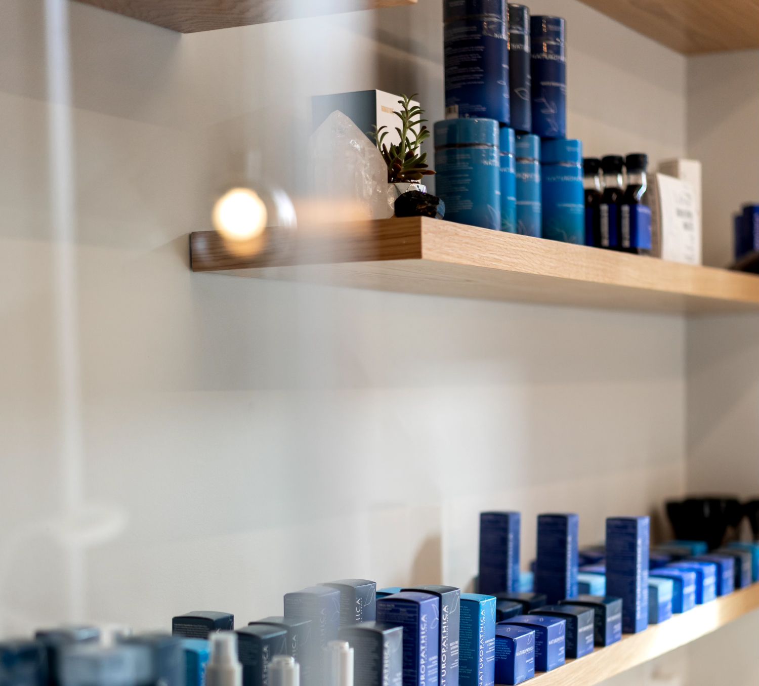 Shelves displaying various blue skincare products.